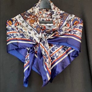 100% polyester scarf. Navy, rust, yellow